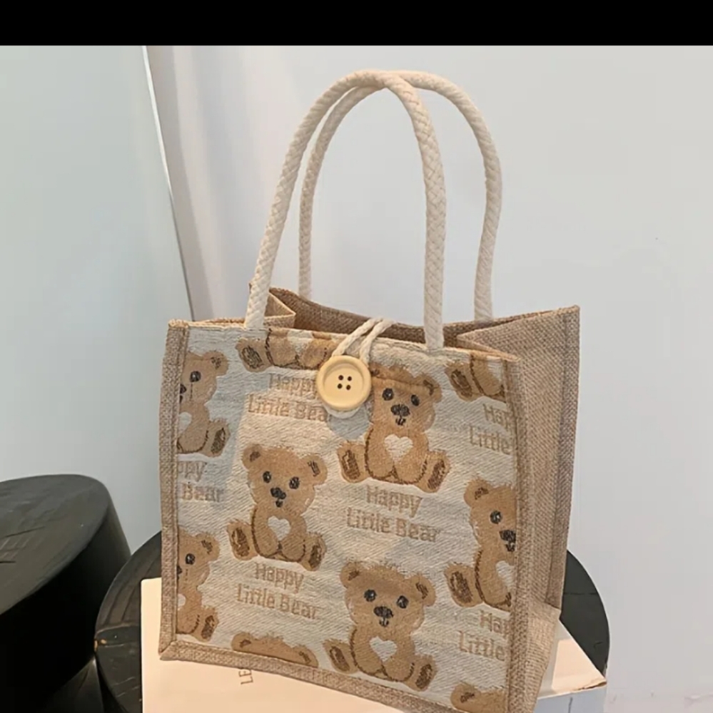 Small burlap bag with bear motif.